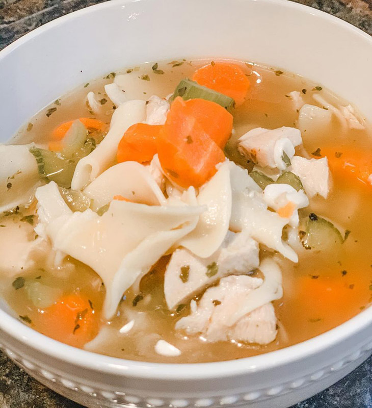 A bowl of warm homemade chicken noodle soup