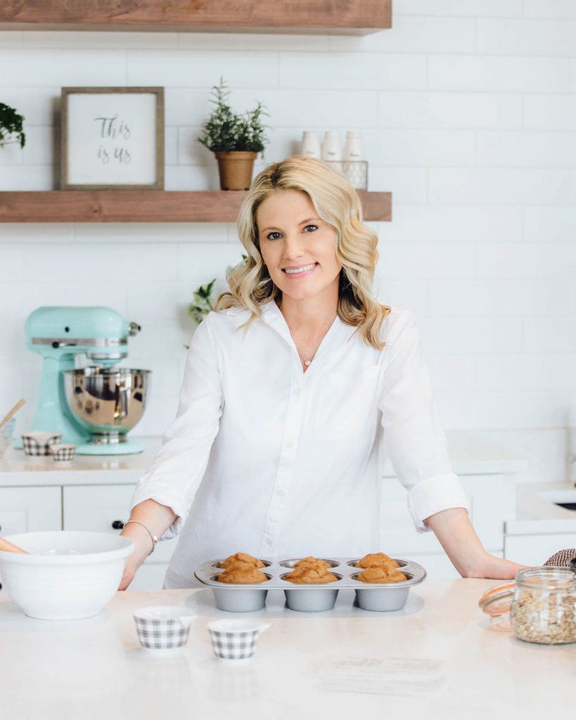 Shannon standing in her kitchen