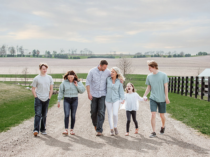 Shannon's family outside at a farm.